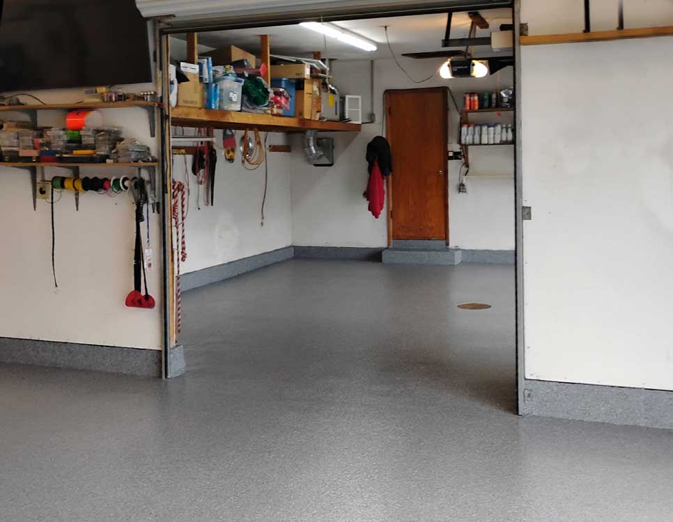 Garage Floor with Epoxy Coating in a clean, organized workshop featuring durable, seamless flooring for long-lasting performance and easy maintenance.