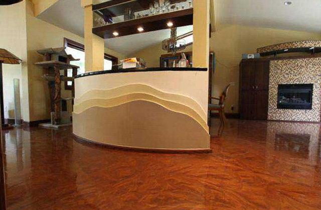 Residential Metallic Floor with a rich, glossy copper finish in a stylish living space featuring modern architecture and custom curved wall accents.